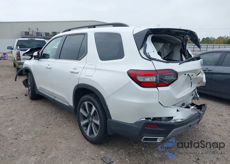 2025 Honda Pilot Touring z USA, uszkodzony, nr VIN 5FNYG2H73SB024325